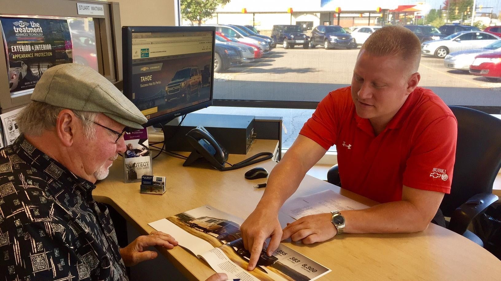 Customer and employee working on paperwork